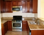 pre-fab-maple-cabinets-granite-countertops-new-electrical-outlets-under-mount-sink